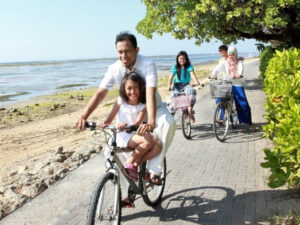 Family bikes near the beach