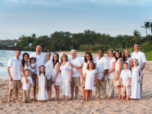 large family pose on beach